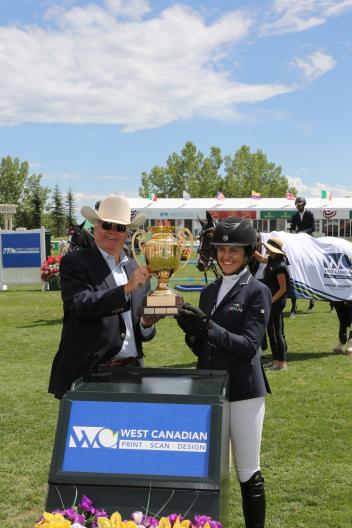 Mckayla Langmeier in her winning presentation with George Brookman, CEO West Canadian. 